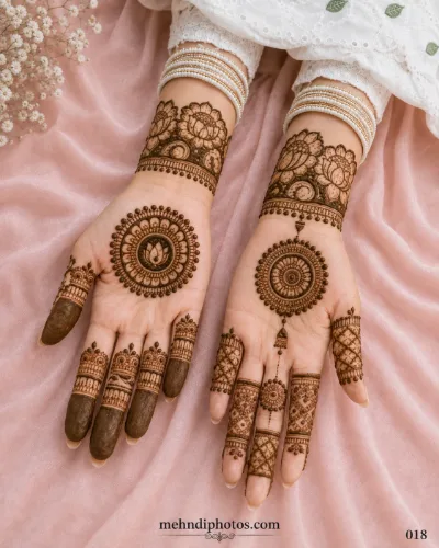 Engagement full hand mehndi design featuring lotus flowers, circular mandala patterns, delicate dots and traditional finger details.