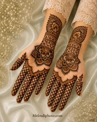 Symmetrical front hand mehndi design with large lotus mandalas on both palms, checkerboard finger patterns and detailed decorative wrist bands.