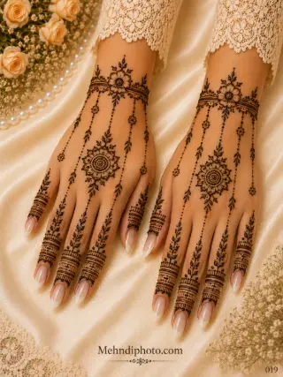 Simple back hand mehndi design on both hands with floral wrist bracelets, hanging dotted chains, central flower motifs and leafy finger patterns.