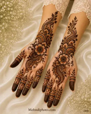 Bridal front hand mehndi design with floral and paisley artwork and intricate Indian henna extending across both palms and forearms.