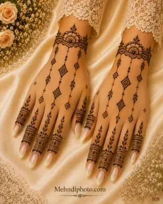 Simple back hand mehndi design on both hands with floral wrist bracelets, hanging diamond pendants, leafy chains and decorative finger bands